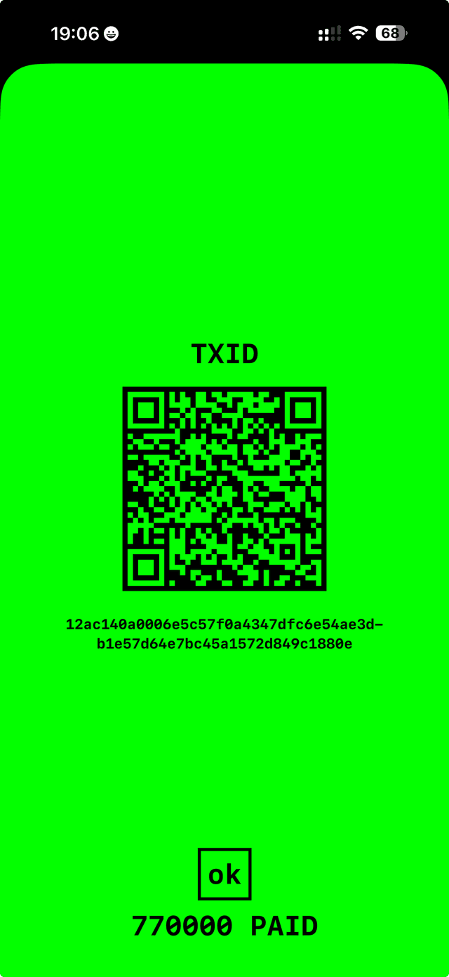 The PAID receipt after broadcast: TXID rendered as both hex and a QR code so it can be scanned into any block explorer. 770,000 PAID.